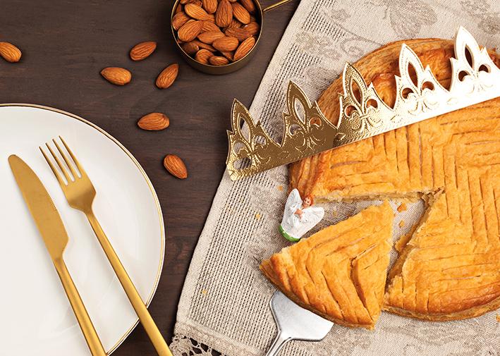 King cake or galette des rois in French. Traditional epiphany pie with golden paper crown and tiny charms